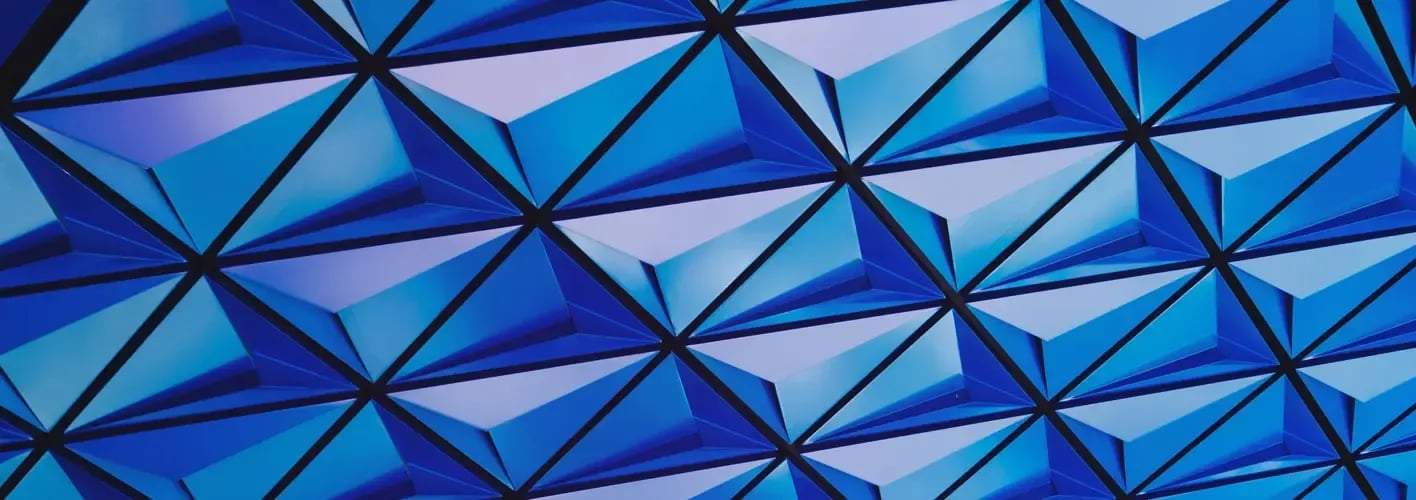 Blog_Abstract_blue and aqua geometric architecture with triangle shapes