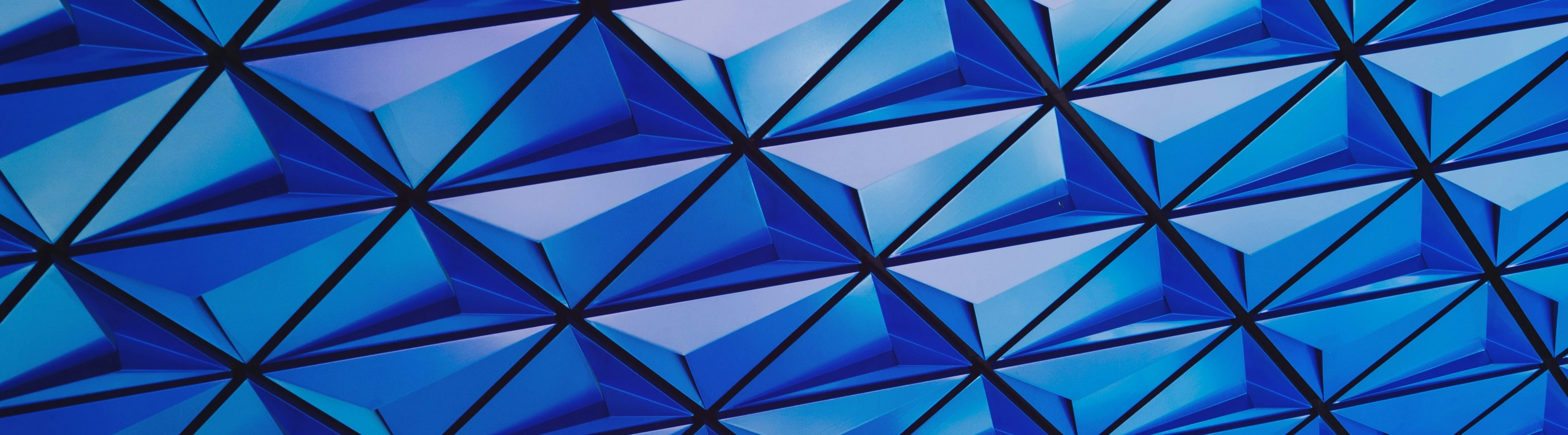Blog_Abstract_blue and aqua geometric architecture with triangle shapes (Web Optimized)