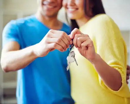 Couple holding house keys