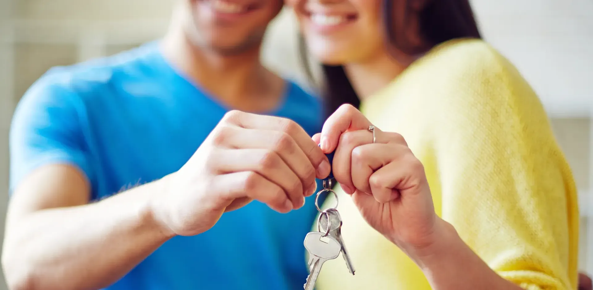 Couple holding house keys