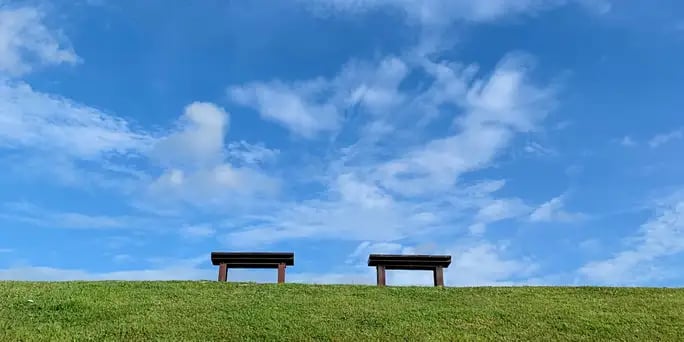 Blog_Inspirational_ Blue Sky and Green Grass with Two Benches in Foreground