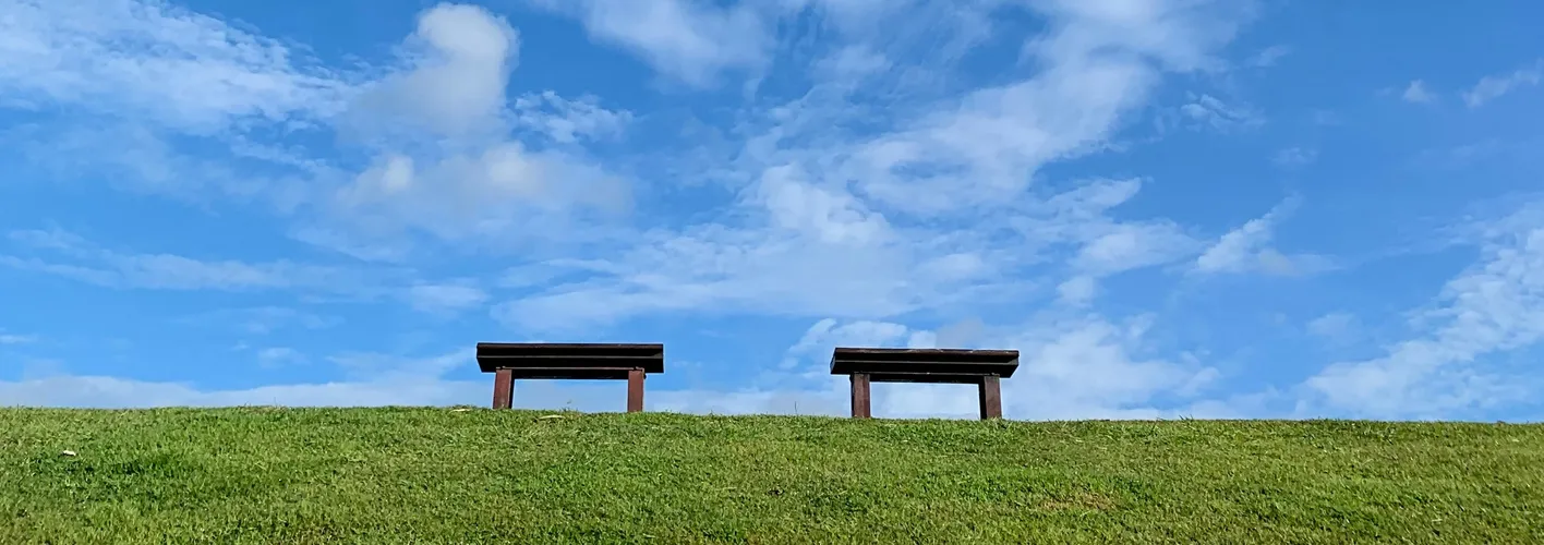 Blog_Inspirational_ Blue Sky and Green Grass with Two Benches in Foreground