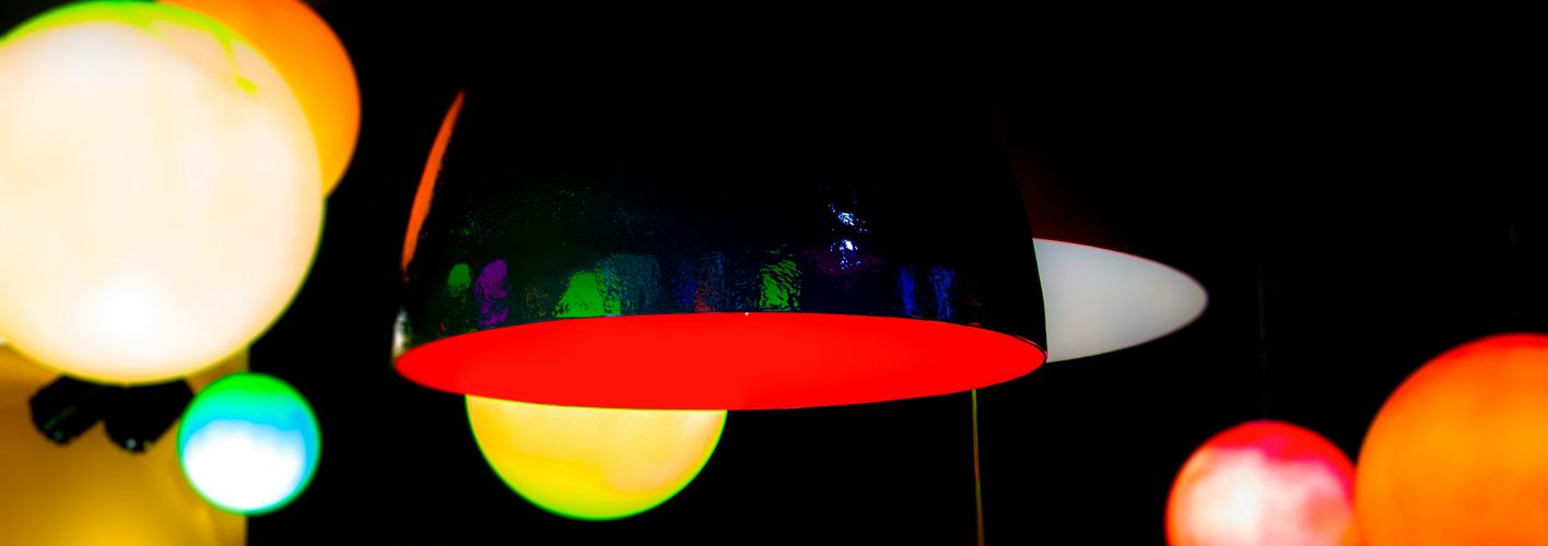 Blog_Abstract_colorful lights hanging with black background (Original)